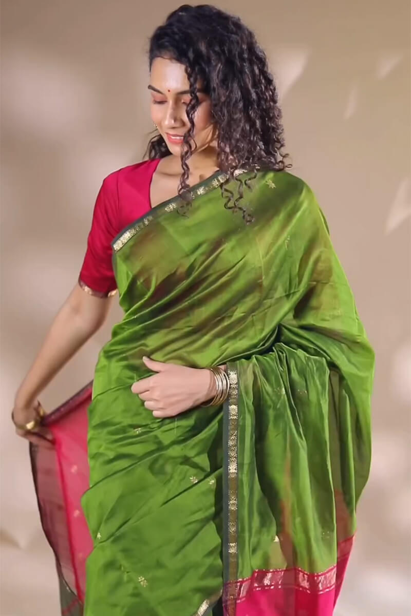 Opulent Green Cotton Silk Saree With Demanding Blouse Piece